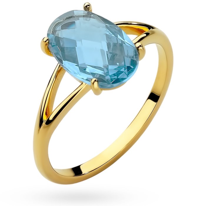 Złoty pierścionek z dużym niebieskim kamieniem